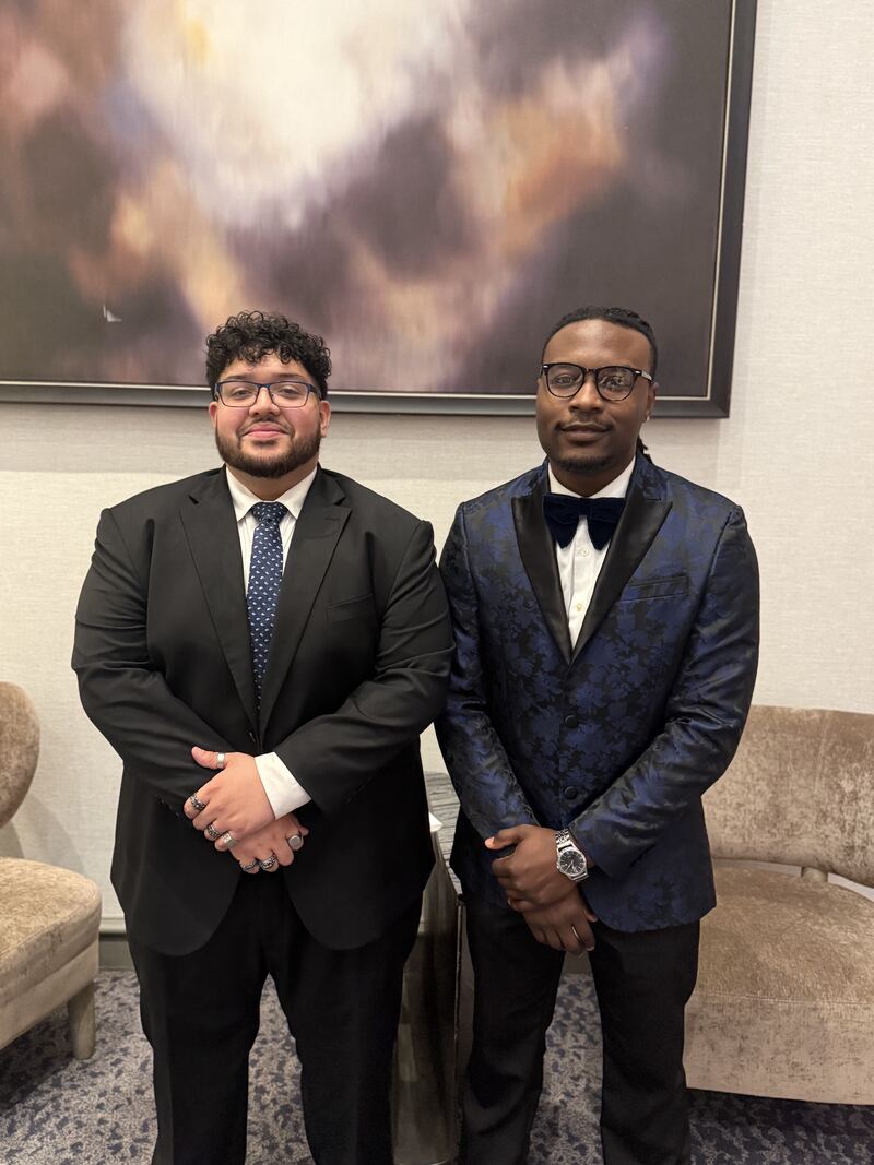 Two Mainline Strategies team members at a company recognition event