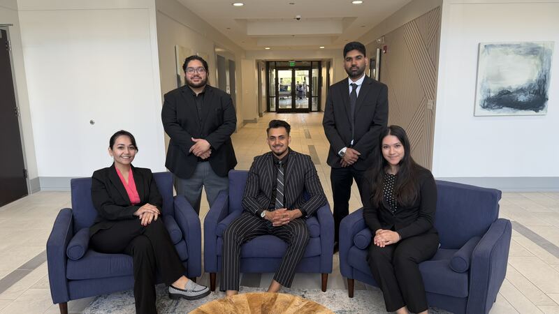 Mainline Strategies team members seated together in the office lobby